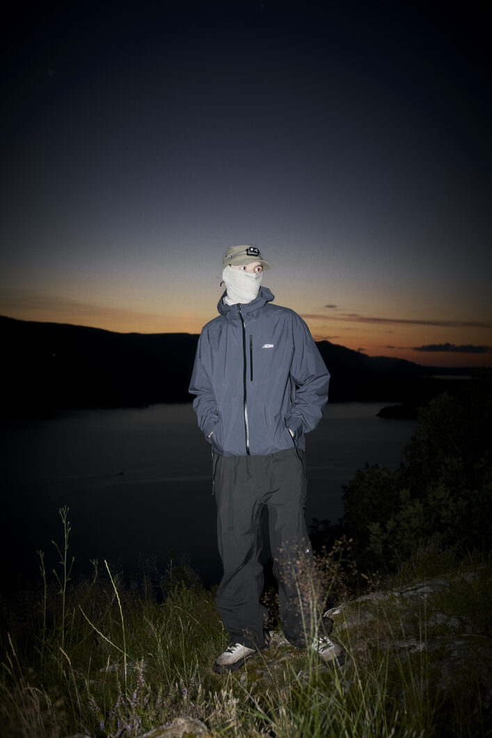 Trail Duster night shoot, wearing ELLIKER Navy Ayer Shell Jacket and Black Bordley Shell Trousers